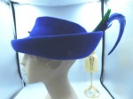 blue hat green feather side main